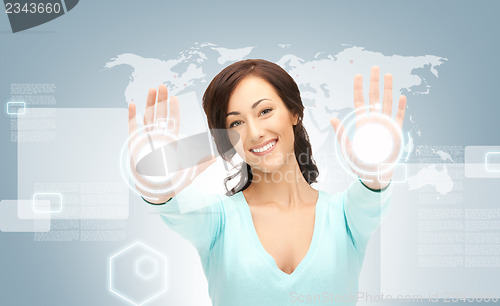 Image of businesswoman working with touch screen