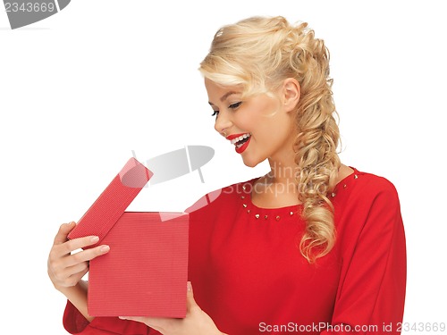 Image of lovely woman in red dress with opened gift box