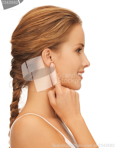 Image of woman pointing to ear