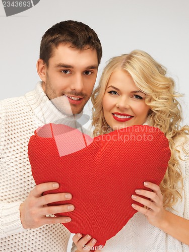 Image of family couple in a sweaters with heart