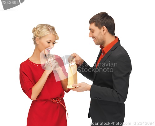 Image of man and woman with present