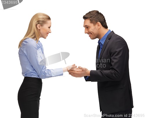 Image of man and woman showing something on the palms