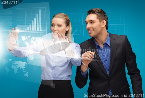 Image of man and woman working with virtual touch screens