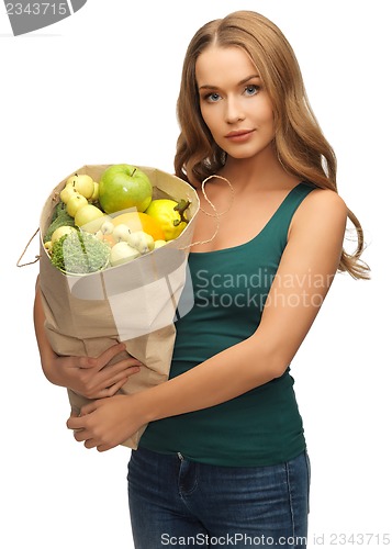 Image of woman with shopping bag full of fruits