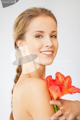 Image of lovely woman with lily flower