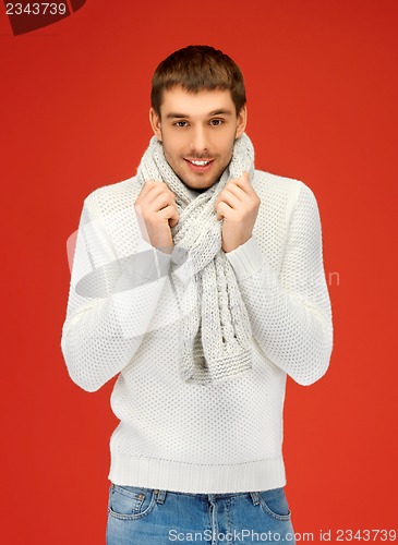 Image of handsome man in warm sweater and scarf