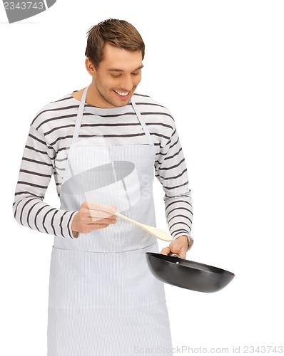 Image of handsome man with pan and spoon