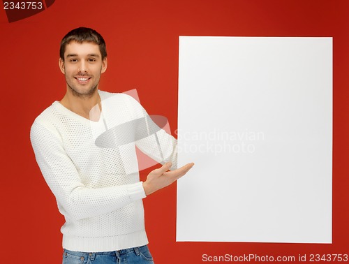 Image of handsome man with big blank board