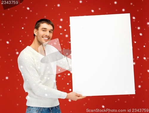 Image of handsome man with big blank board