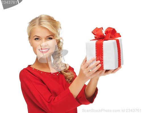 Image of lovely woman in red dress with present