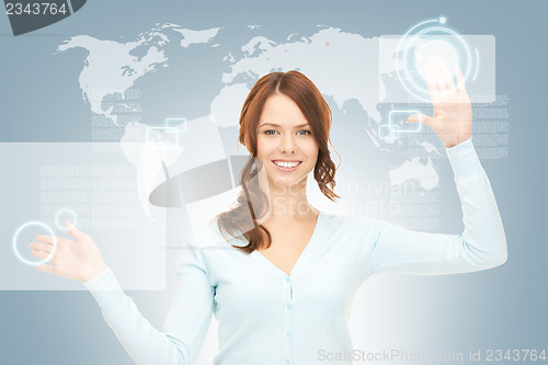 Image of businesswoman working with touch screen