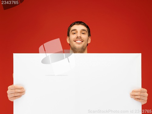 Image of handsome man with big blank board