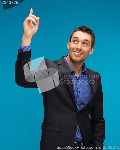 Image of man in suit with his finger up