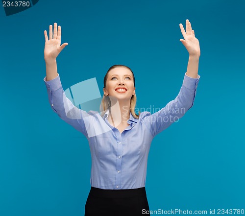 Image of woman working with something imaginary