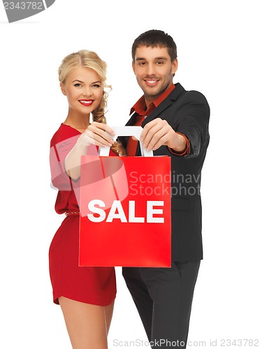 Image of man and woman with shopping bag