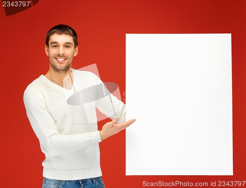 Image of handsome man with big blank board