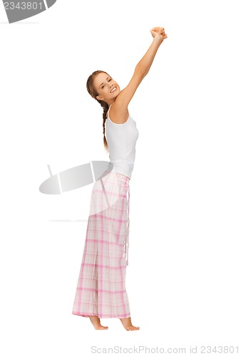 Image of woman in pajamas doing morning exercise