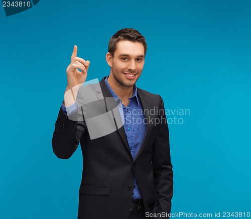 Image of man in suit with his finger up