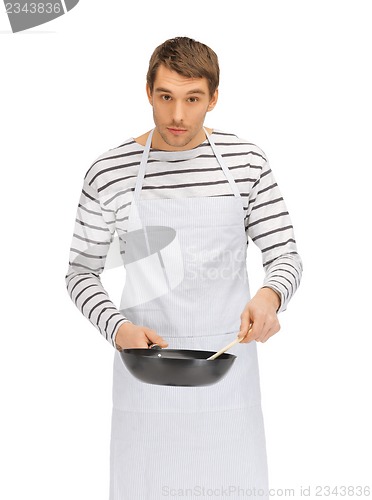 Image of handsome man with pan and spoon