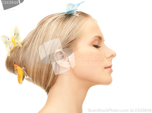 Image of woman with butterfly in hair