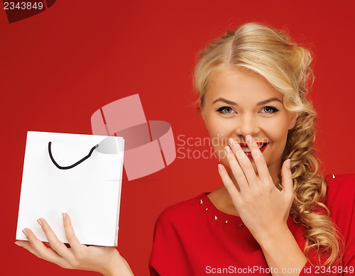 Image of lovely woman in red dress with shopping bag