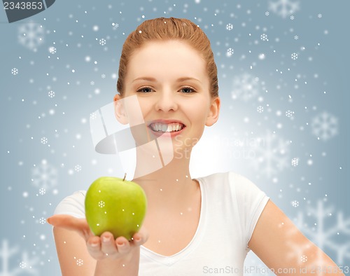 Image of teenage girl with green apple