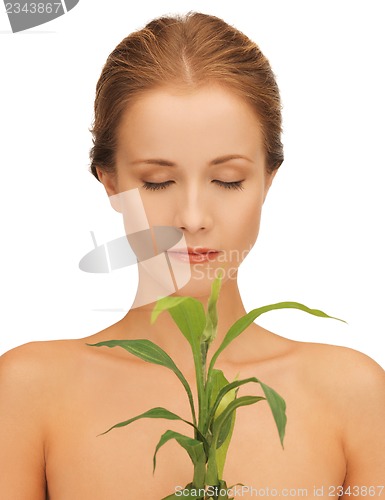 Image of woman with green sprout