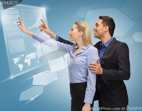 Image of man and woman working with virtual touch screens