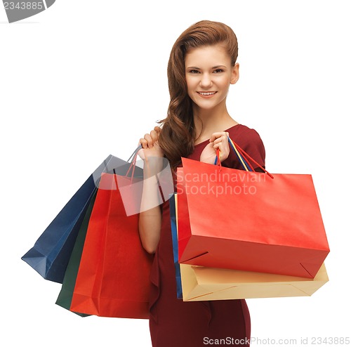 Image of teenage girl in red dress with shopping bags