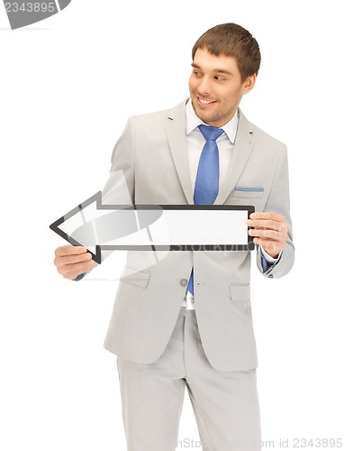 Image of businessman with direction arrow sign