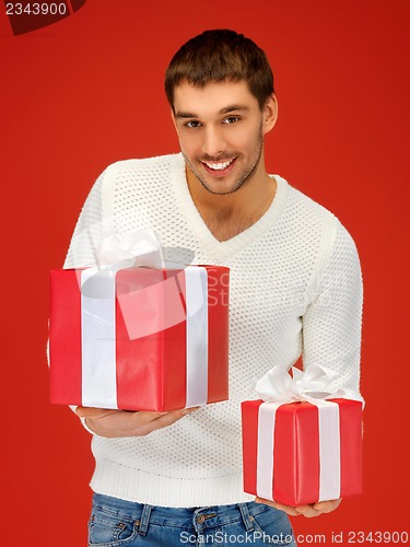 Image of man holding many gift boxes