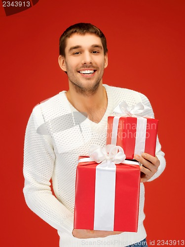 Image of man holding many gift boxes