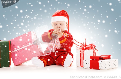 Image of santa helper baby with christmas gifts