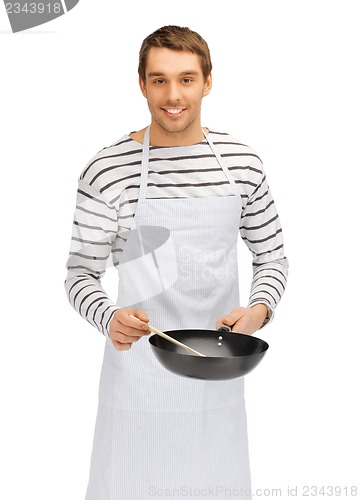 Image of handsome man with pan and spoon