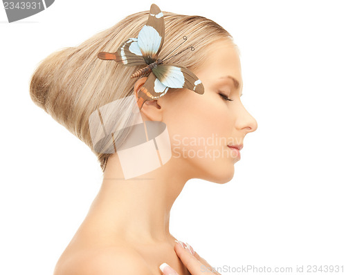 Image of woman with butterfly in hair