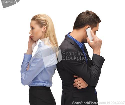 Image of man and woman with cell phones