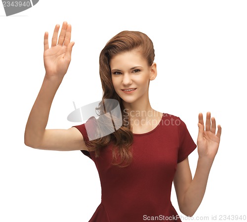 Image of girl in red dress working with something imaginary