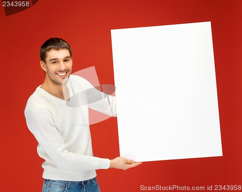 Image of handsome man with big blank board