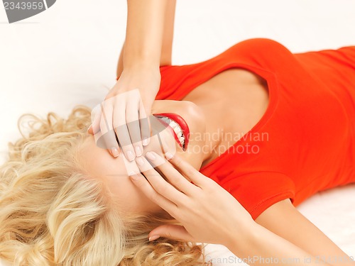 Image of lying pensive beautiful woman with closed eyes