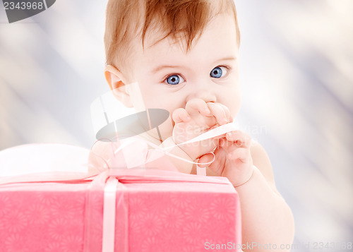 Image of baby boy with gift box