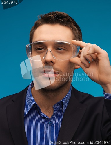 Image of businessman in protective glasses