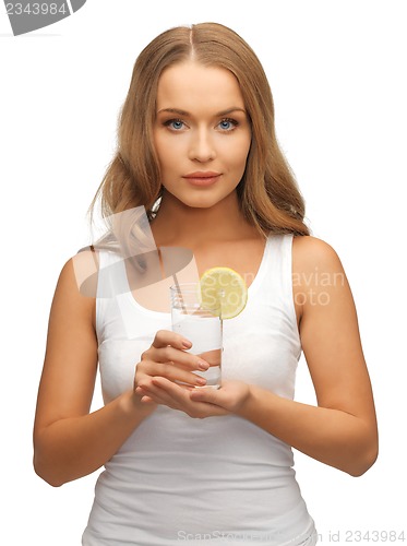 Image of woman with lemon slice on glass of water