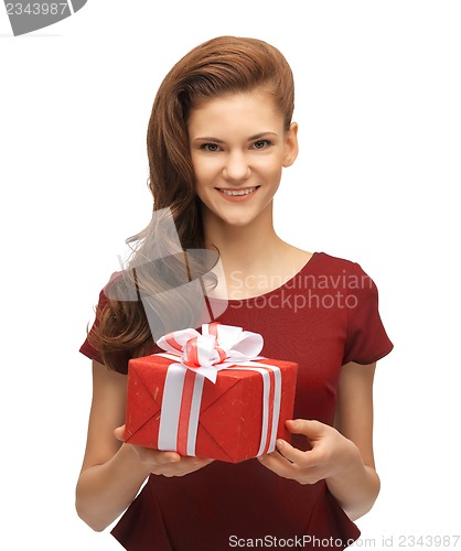 Image of teenage girl in red dress with gift box