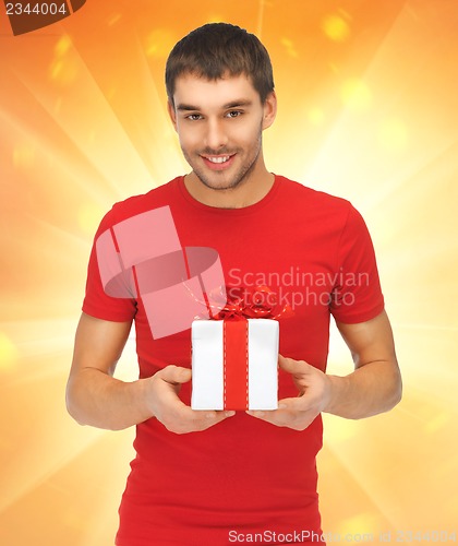 Image of handsome man with a gift