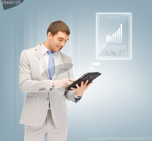 Image of happy man with tablet pc computer