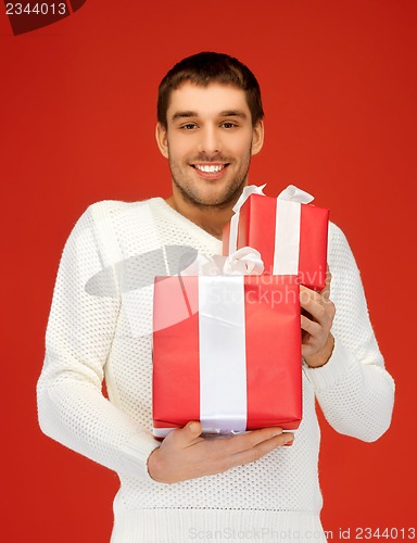 Image of man holding many gift boxes
