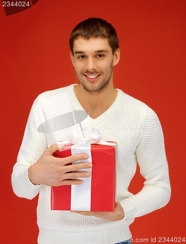 Image of handsome man with a gift