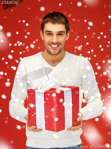 Image of handsome man with a gift