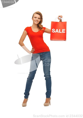 Image of teenage girl in red t-shirt with shopping bag