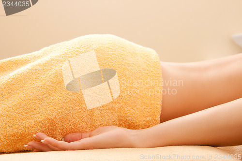 Image of woman lying on massage table